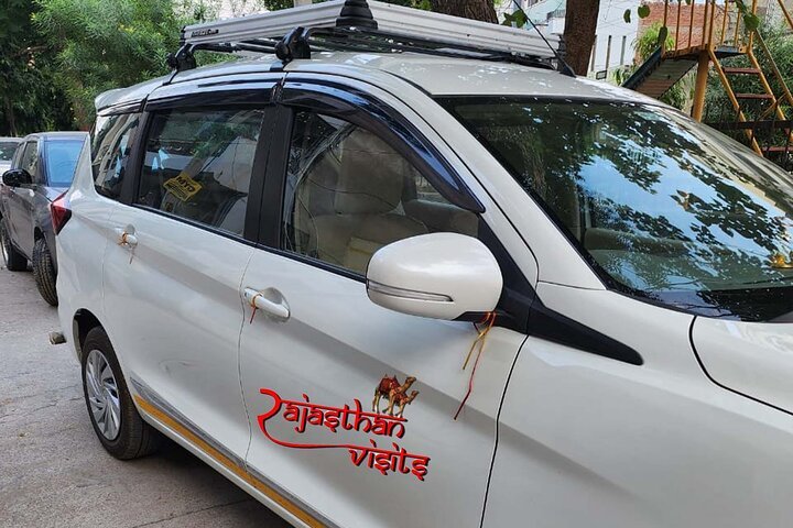 Rajasthan Visits white Ertiga taxi with driver for Agra taxi service